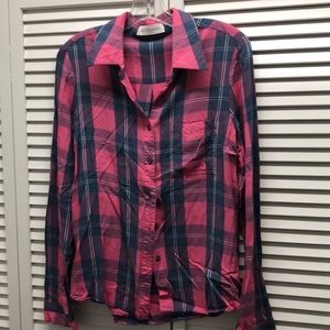 Kittenish button down plaid shirt.